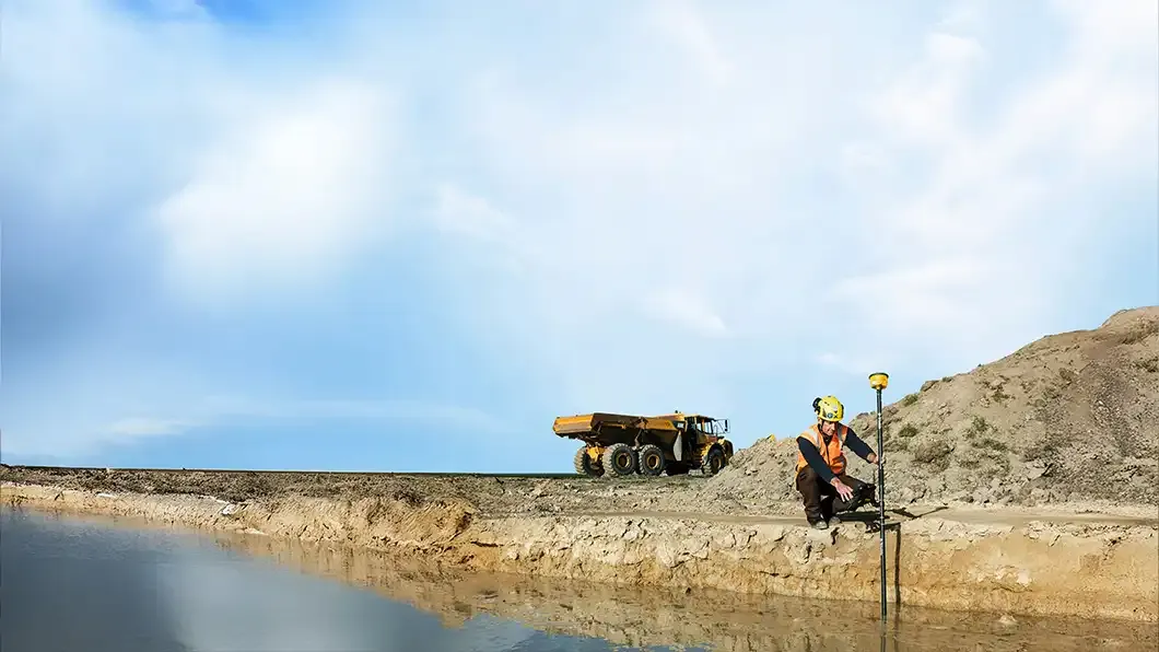 Surveyor utilizing Trimble ProPoint GNSS technology with RTX correction service for centimeter accuracy.