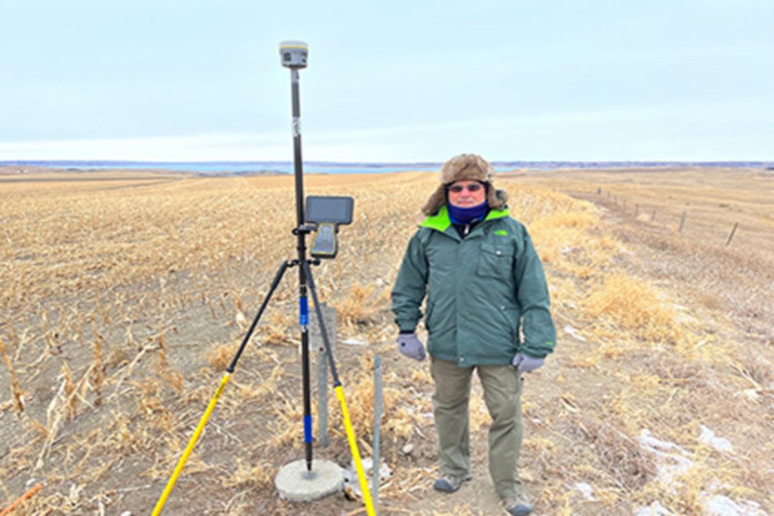 Remote surveying in action: Land surveyor in rugged environment